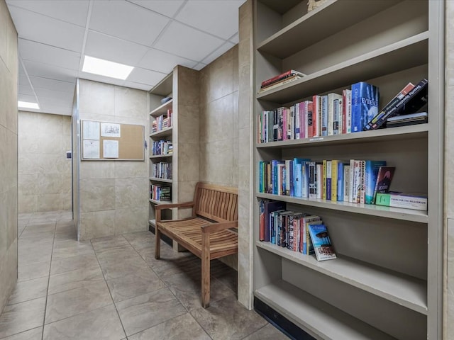 42-30 Douglaston Pkwy Unit 3L, Douglaston, NY 11363 - living area featuring a paneled ceiling and tile patterned floors