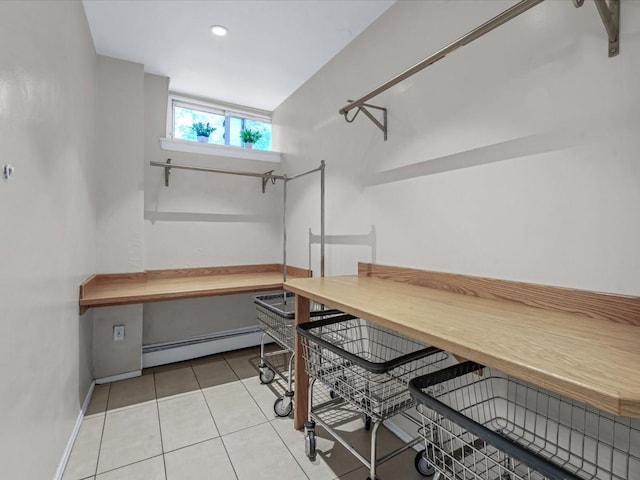 42-30 Douglaston Pkwy Unit 3L, Douglaston, NY 11363 - spacious closet featuring a baseboard radiator and tile patterned flooring