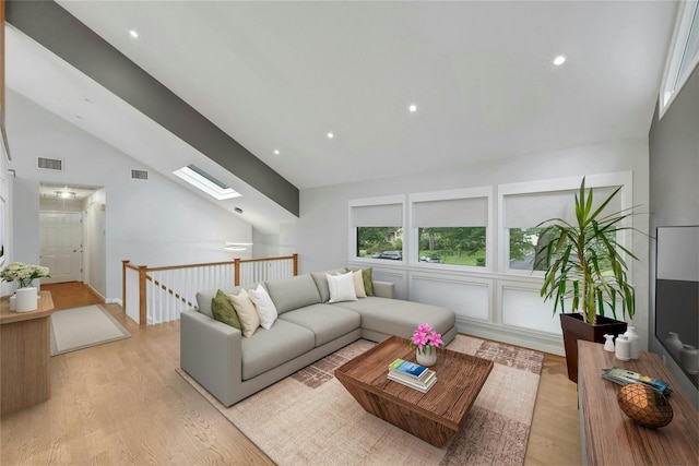 182 Arbor Crst, Somers, NY 10589 - living area featuring light wood-style flooring, a skylight, high vaulted ceiling, and recessed lighting