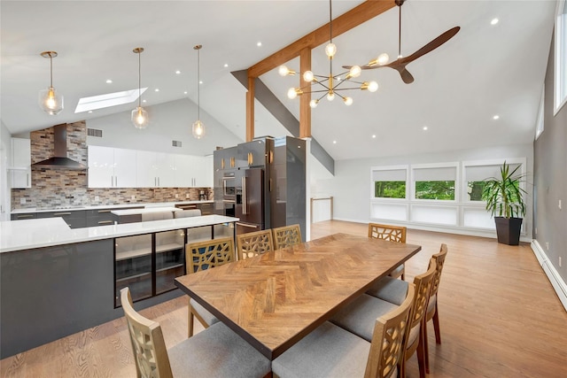 182 Arbor Crst, Somers, NY 10589 - dining space featuring high vaulted ceiling, light wood-style flooring, a skylight, recessed lighting, and a chandelier
