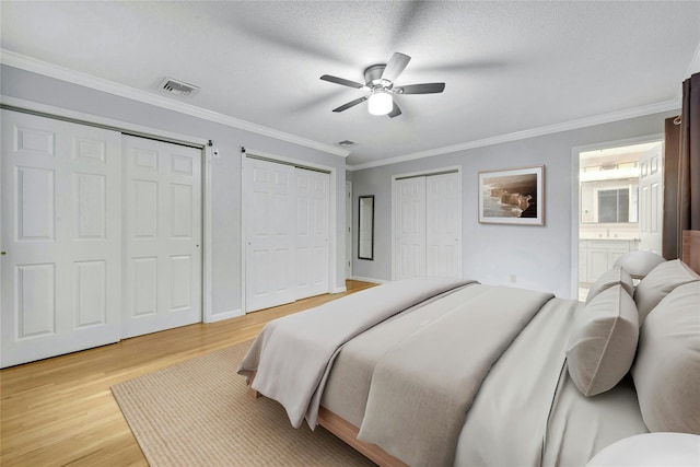 182 Arbor Crst, Somers, NY 10589 - bedroom with multiple closets, light wood-type flooring, ornamental molding, ensuite bathroom, and a ceiling fan