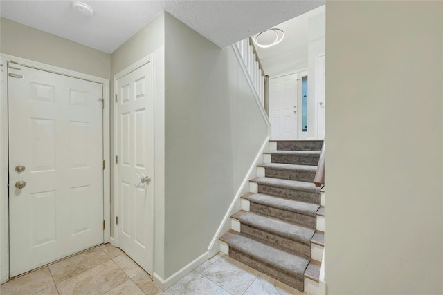 182 Arbor Crst, Somers, NY 10589 - stairway with baseboards and tile patterned flooring