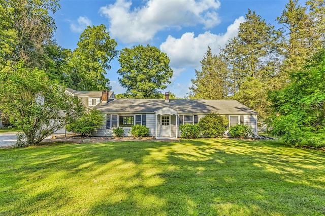 8 W Ln, South Salem, NY 10590 - view of front of house with a front yard and a chimney