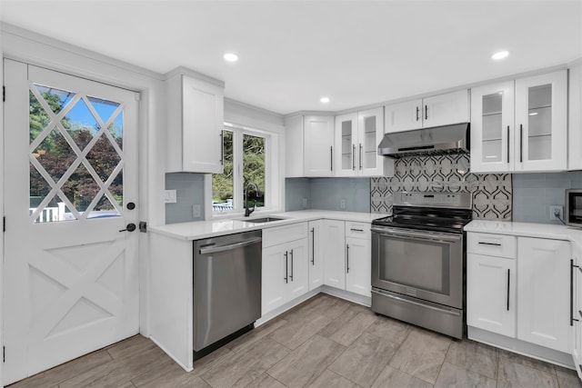 8 W Ln, South Salem, NY 10590 - kitchen with stainless steel appliances, under cabinet range hood, light countertops, tasteful backsplash, and recessed lighting