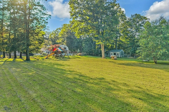 8 W Ln, South Salem, NY 10590 - view of grassy yard with a playground and a storage shed