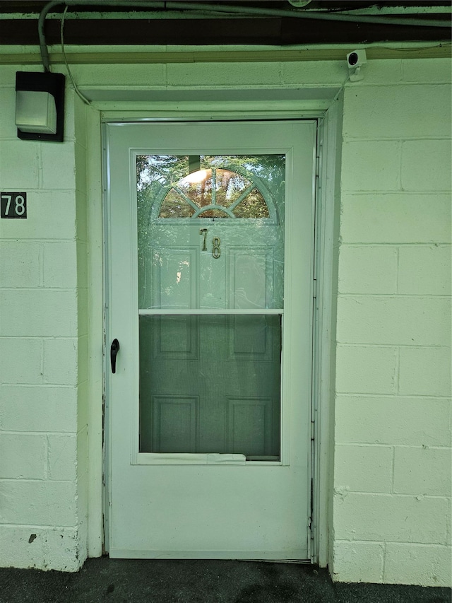 78 Carmine Dr Unit D14, Wappingers Falls, NY 12590 - property entrance with concrete block siding and a surveillance system