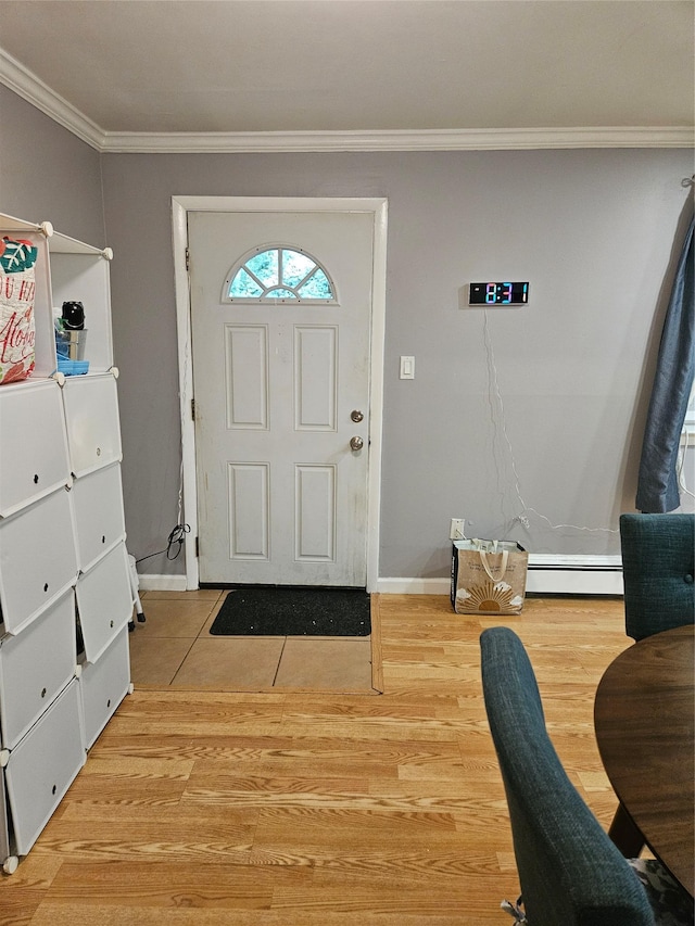 78 Carmine Dr Unit D14, Wappingers Falls, NY 12590 - entryway featuring baseboard heating, crown molding, and wood finished floors