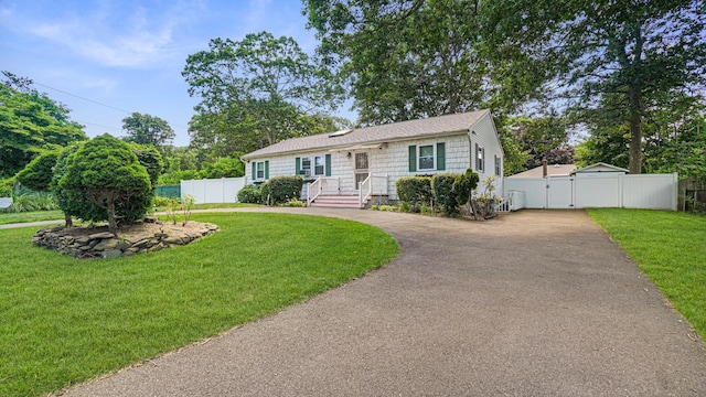 70 Wilson Ave, Mastic Beach, NY 11951 - view of front of property featuring driveway and a gate