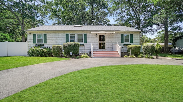 70 Wilson Ave, Mastic Beach, NY 11951 - view of front of home featuring asphalt driveway and roof with shingles