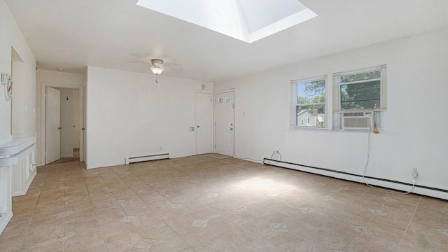 70 Wilson Ave, Mastic Beach, NY 11951 - spare room featuring baseboard heating, a skylight, a baseboard heating unit, a ceiling fan, and cooling unit