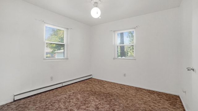 70 Wilson Ave, Mastic Beach, NY 11951 - carpeted spare room with baseboard heating and healthy amount of natural light