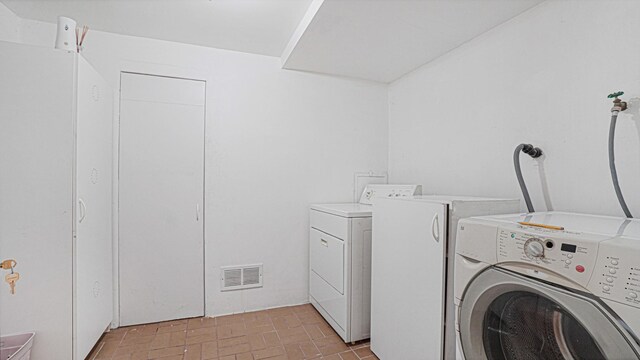 70 Wilson Ave, Mastic Beach, NY 11951 - laundry room featuring separate washer and dryer