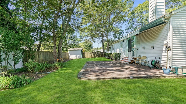 70 Wilson Ave, Mastic Beach, NY 11951 - fenced backyard featuring a shed and a patio