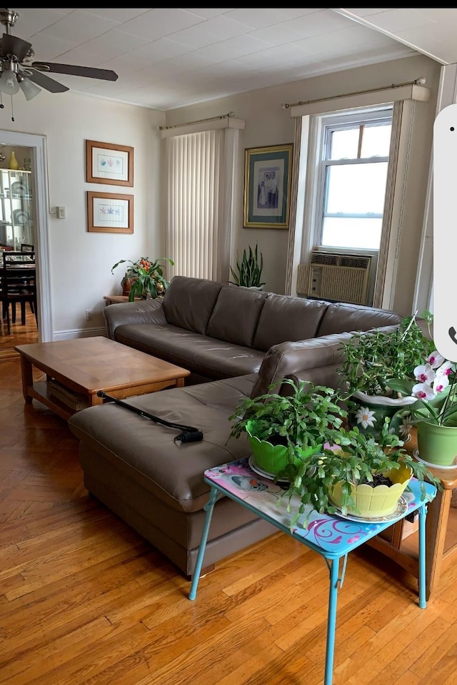 23727 Davenport Ave, Bellerose, NY 11426 - living room featuring a ceiling fan, cooling unit, and light wood-type flooring