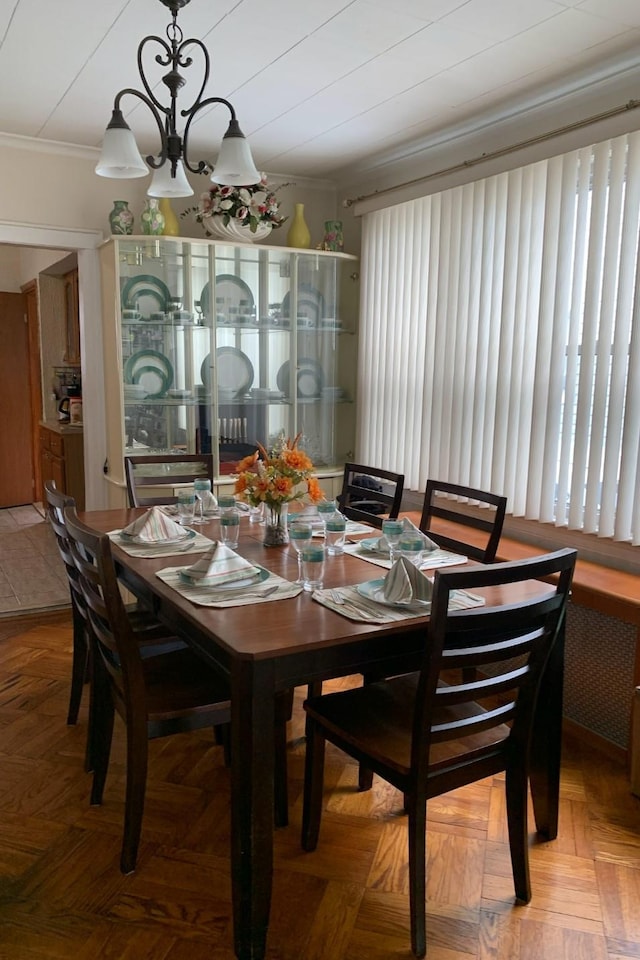 23727 Davenport Ave, Bellerose, NY 11426 - dining room featuring ornamental molding and a chandelier