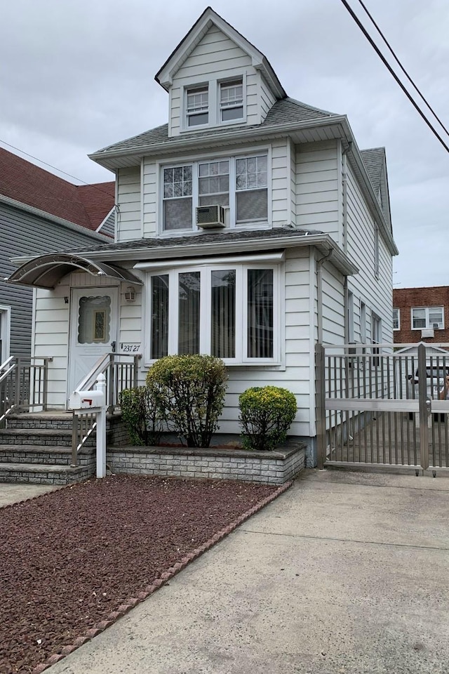 23727 Davenport Ave, Bellerose, NY 11426 - american foursquare style home featuring a gate and roof with shingles