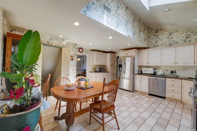 121 6th St, Hicksville, NY 11801 - dining room with wallpapered walls, light tile patterned floors, and recessed lighting