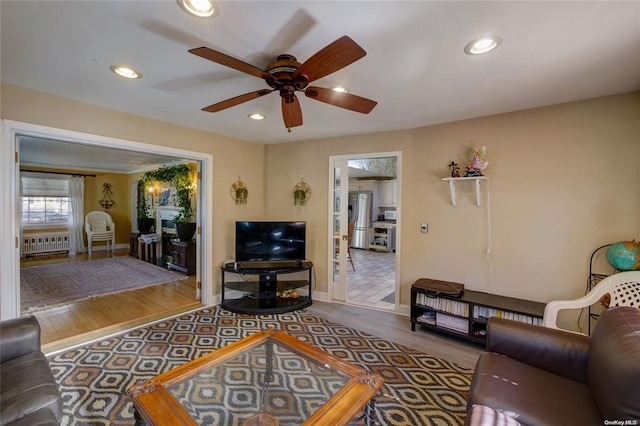 121 6th St, Hicksville, NY 11801 - living room with ceiling fan, recessed lighting, radiator, and wood finished floors