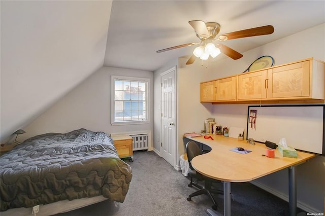 121 6th St, Hicksville, NY 11801 - bedroom with radiator, lofted ceiling, dark colored carpet, an office area, and a ceiling fan