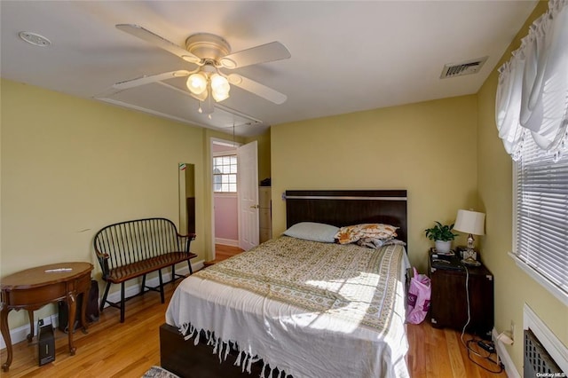 121 6th St, Hicksville, NY 11801 - bedroom with light wood finished floors and ceiling fan