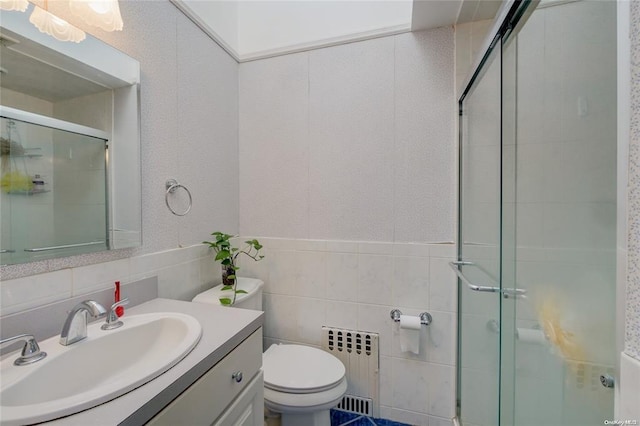 121 6th St, Hicksville, NY 11801 - full bathroom with radiator, a stall shower, vanity, and tile walls