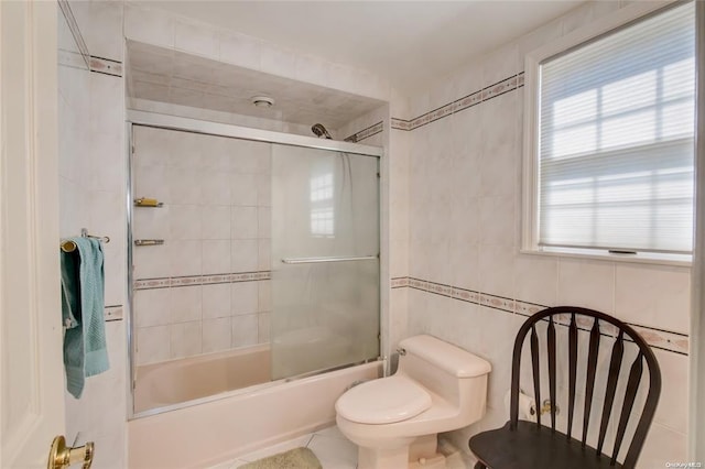 121 6th St, Hicksville, NY 11801 - bathroom featuring tile walls, healthy amount of natural light, and enclosed tub / shower combo