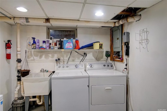 121 6th St, Hicksville, NY 11801 - washroom featuring electric panel and washing machine and clothes dryer