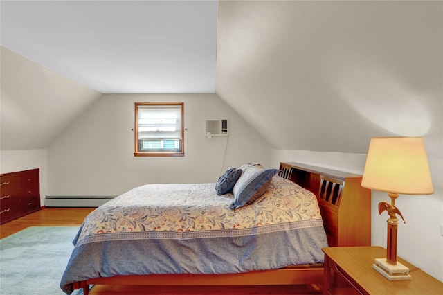 31 Amby Ave, Plainview, NY 11803 - bedroom featuring baseboard heating, wood finished floors, a wall mounted AC, and vaulted ceiling
