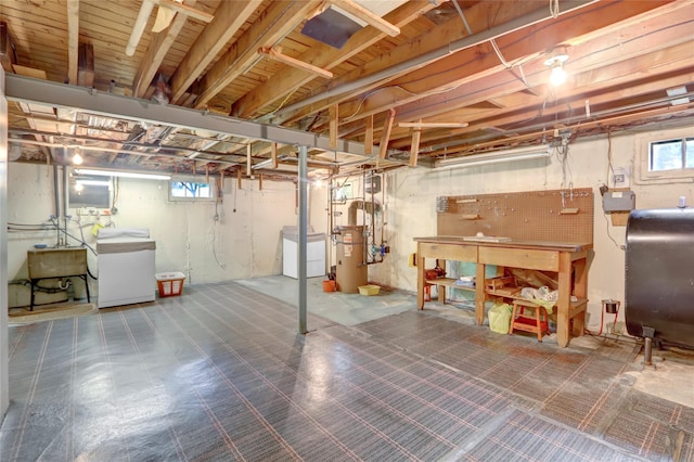 31 Amby Ave, Plainview, NY 11803 - basement with heating fuel, washer / dryer, a workshop area, and tile patterned floors