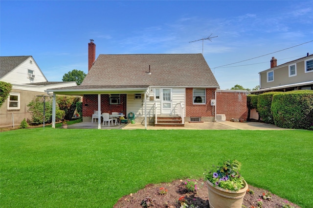 31 Amby Ave, Plainview, NY 11803 - back of house featuring a fenced backyard, a patio area, a chimney, and brick siding