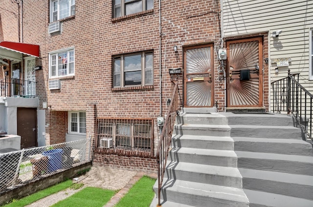 1025 E 229th St Unit B, Bronx, NY 10466 - doorway to property with brick siding and cooling unit
