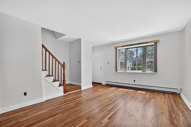 1025 E 229th St Unit B, Bronx, NY 10466 - foyer with a baseboard heating unit, hardwood / wood-style flooring, and stairway
