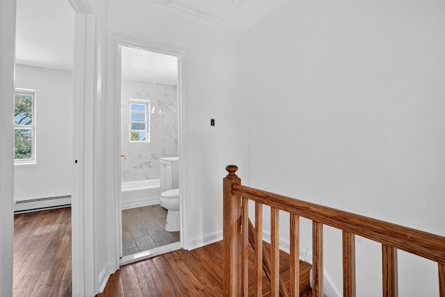 1025 E 229th St Unit B, Bronx, NY 10466 - hallway featuring a baseboard radiator, wood finished floors, and an upstairs landing