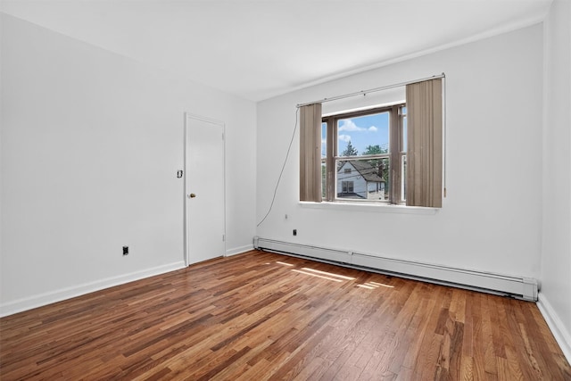 1025 E 229th St Unit B, Bronx, NY 10466 - empty room with a baseboard radiator and wood finished floors