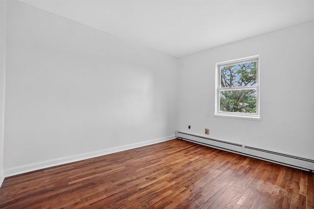1025 E 229th St Unit B, Bronx, NY 10466 - unfurnished room with baseboard heating and hardwood / wood-style floors