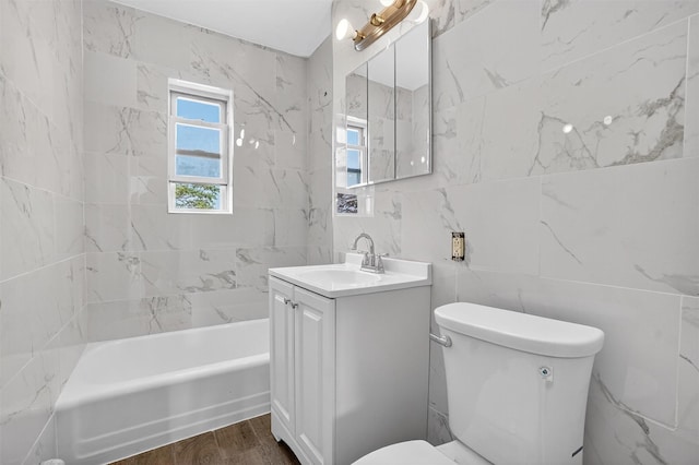 1025 E 229th St Unit B, Bronx, NY 10466 - bathroom with vanity, tile walls, wood finished floors, and shower / tub combination