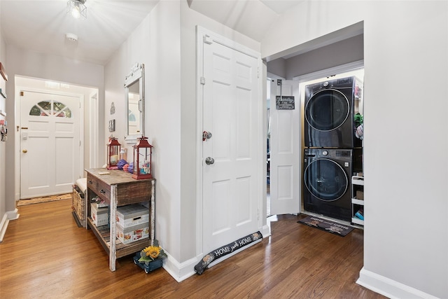 69 Ardell Rd, Bronxville, NY 10708 - washroom featuring stacked washing machine and dryer and wood finished floors