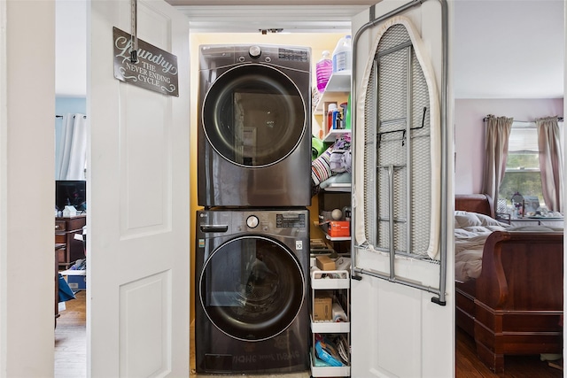 69 Ardell Rd, Bronxville, NY 10708 - laundry room with stacked washing machine and dryer and wood finished floors