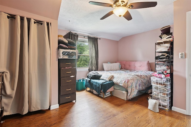 69 Ardell Rd, Bronxville, NY 10708 - bedroom featuring wood finished floors, a textured ceiling, lofted ceiling, and a ceiling fan
