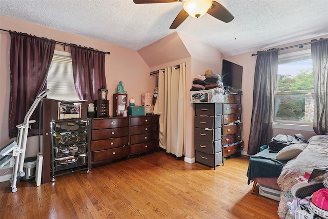 69 Ardell Rd, Bronxville, NY 10708 - bedroom featuring a textured ceiling, wood finished floors, lofted ceiling, and a ceiling fan