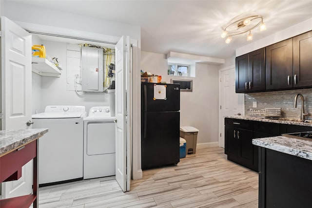 69 Ardell Rd, Bronxville, NY 10708 - washroom with electric panel, washing machine and dryer, and light wood-style flooring
