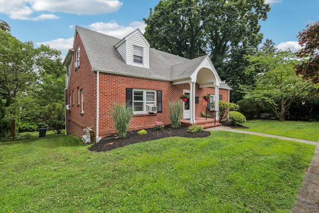 4 Aldine Park, Nyack, NY 10960 - new england style home featuring brick siding, a front yard, and a shingled roof