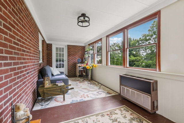 4 Aldine Park, Nyack, NY 10960 - sunroom with heating unit, brick wall, wood finished floors, and crown molding