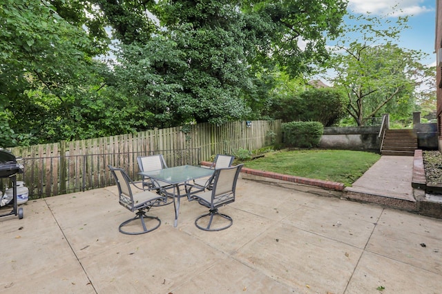 4 Aldine Park, Nyack, NY 10960 - fenced backyard with outdoor dining space, a patio area, stairway, and a grill
