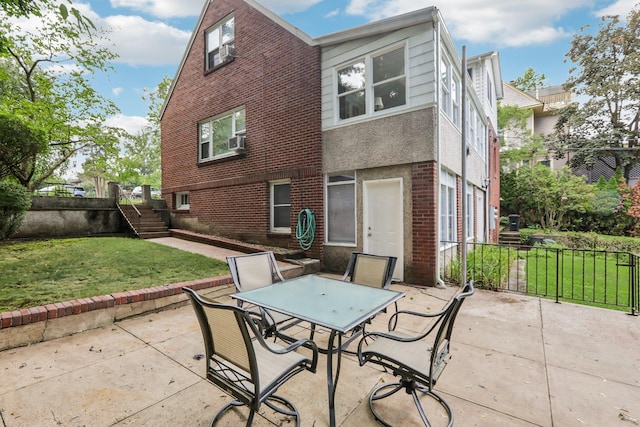 4 Aldine Park, Nyack, NY 10960 - rear view of property with a patio, outdoor dining space, brick siding, and a lawn