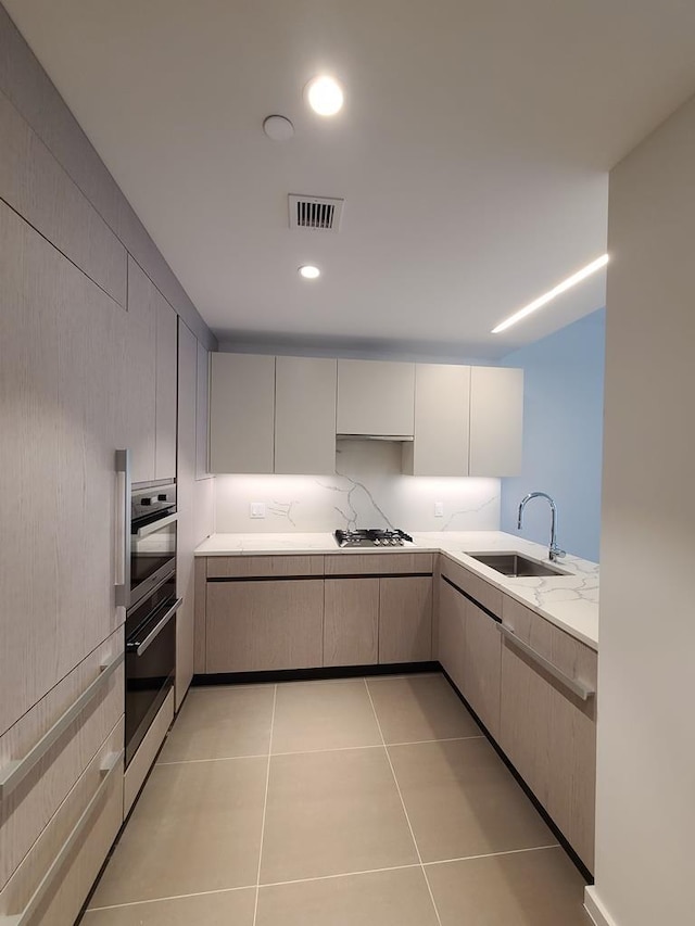 133-27 39th Ave, Flushing, NY 11354 - kitchen with light stone counters, stainless steel appliances, light tile patterned floors, and recessed lighting