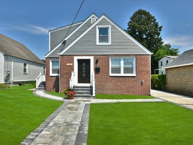 180 Evelyn Rd, Mineola, NY 11501 - bungalow with a front lawn, brick siding, and entry steps
