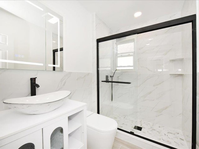 180 Evelyn Rd, Mineola, NY 11501 - full bathroom featuring a marble finish shower, vanity, and tile walls