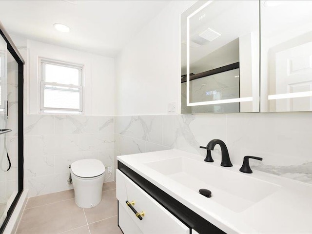 180 Evelyn Rd, Mineola, NY 11501 - full bathroom with a shower stall, vanity, tile patterned flooring, tile walls, and a wainscoted wall