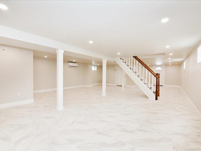 180 Evelyn Rd, Mineola, NY 11501 - finished below grade area with an AC wall unit, stairway, recessed lighting, and light marble finish flooring